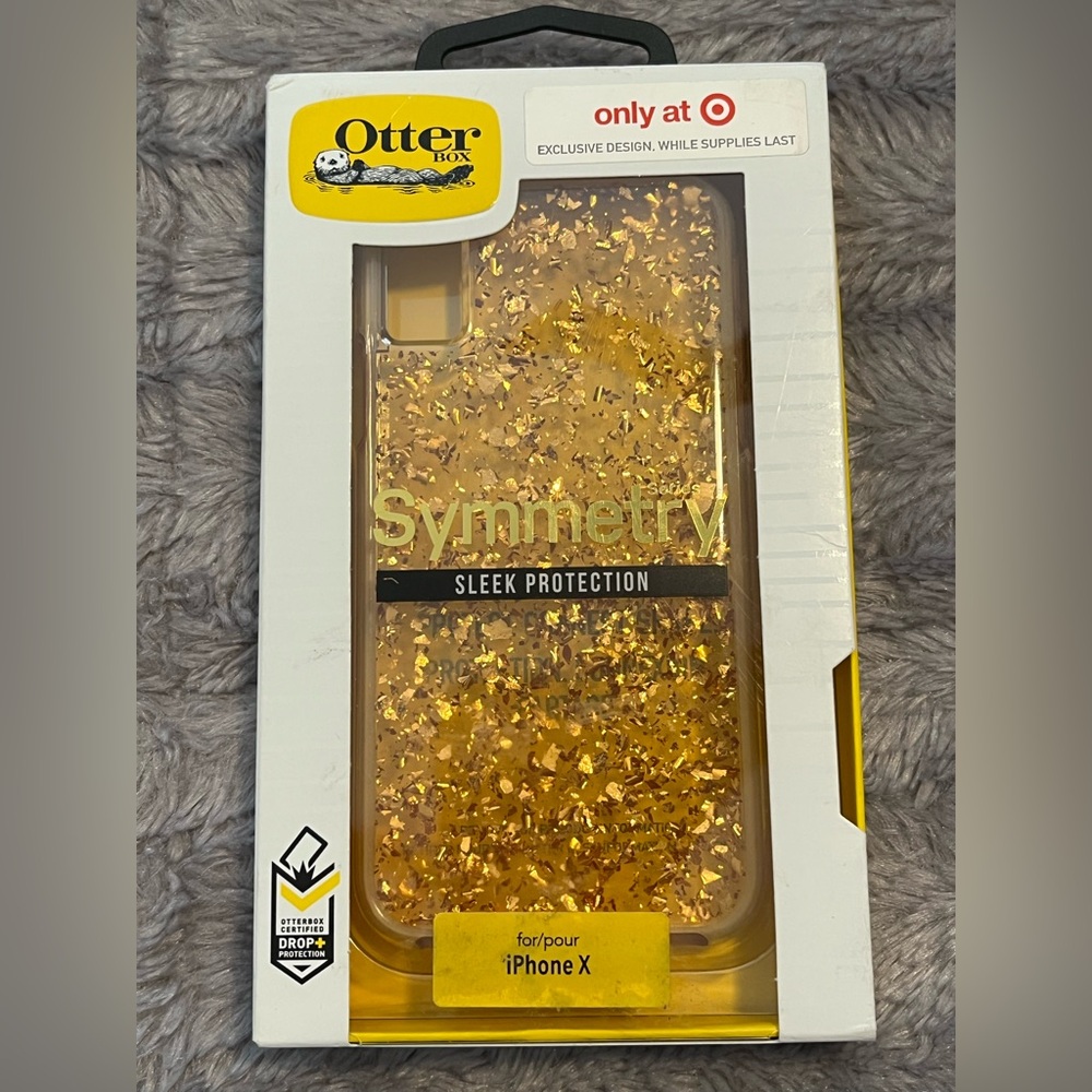 Otter box I phone x case. Clear with gold